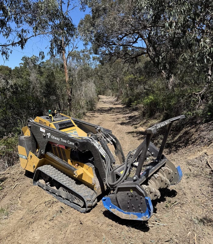 Forestry mulching machine clearing scrub along a bush track