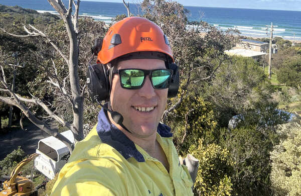 Tom Kleindienst, qualified arborist at Otway Tree Care, overlooking the coast