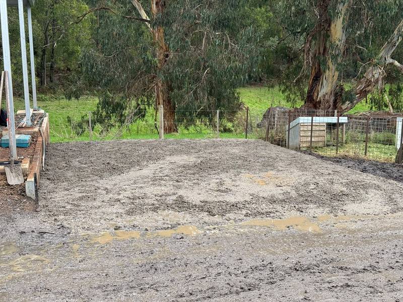 The same area levelled and built up into a gravel parking pad
